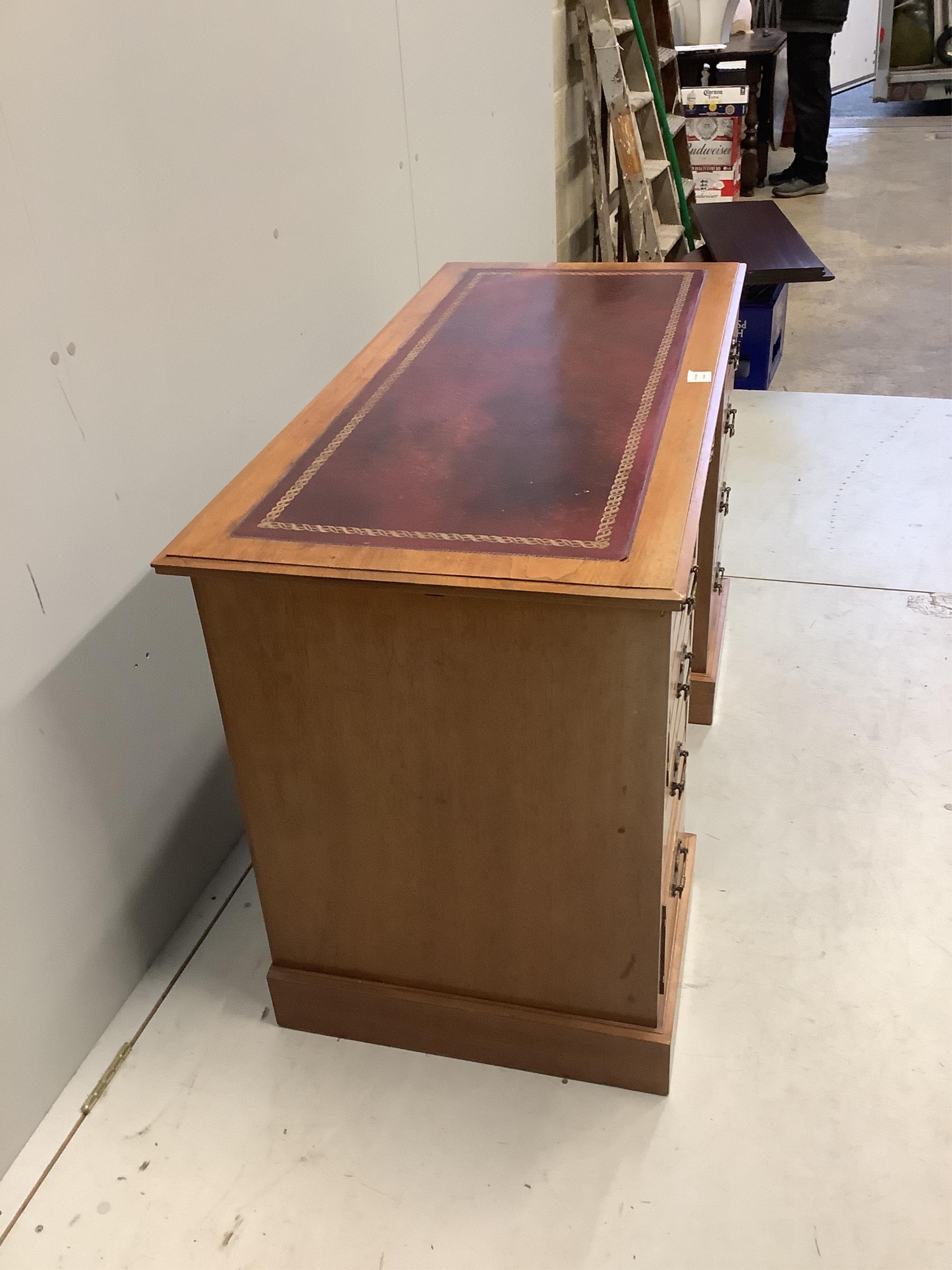 A late Victorian walnut kneehole desk, width 122cm, depth 56cm, height 75cm. Condition - good